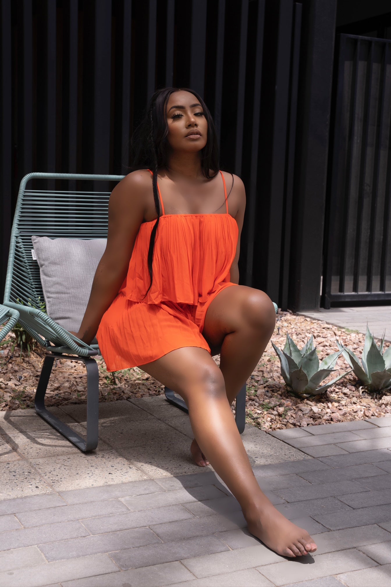 A DAY IN POSITANO PLEATED ROMPER - NEON ORANGE
