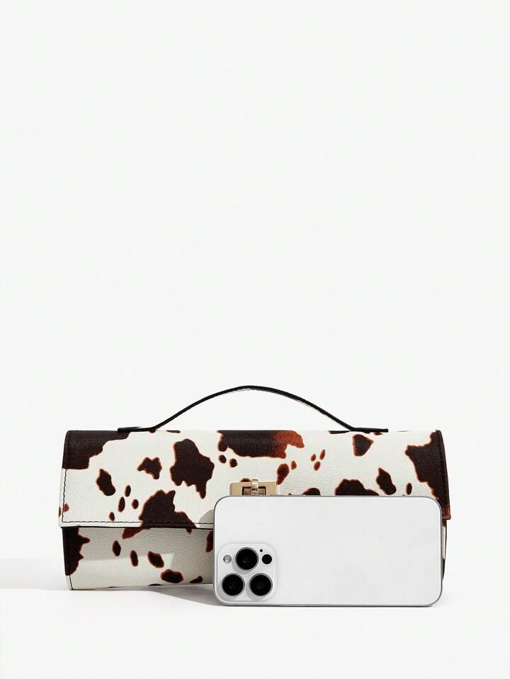 The Valen Vegan Leather Clutch – SADDLE PRINT