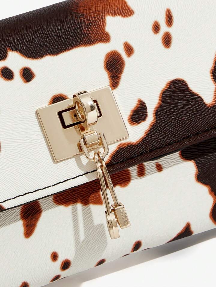 The Valen Vegan Leather Clutch – SADDLE PRINT