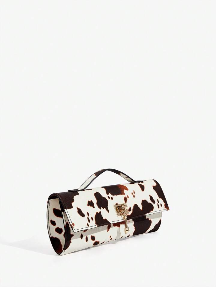 The Valen Vegan Leather Clutch – SADDLE PRINT